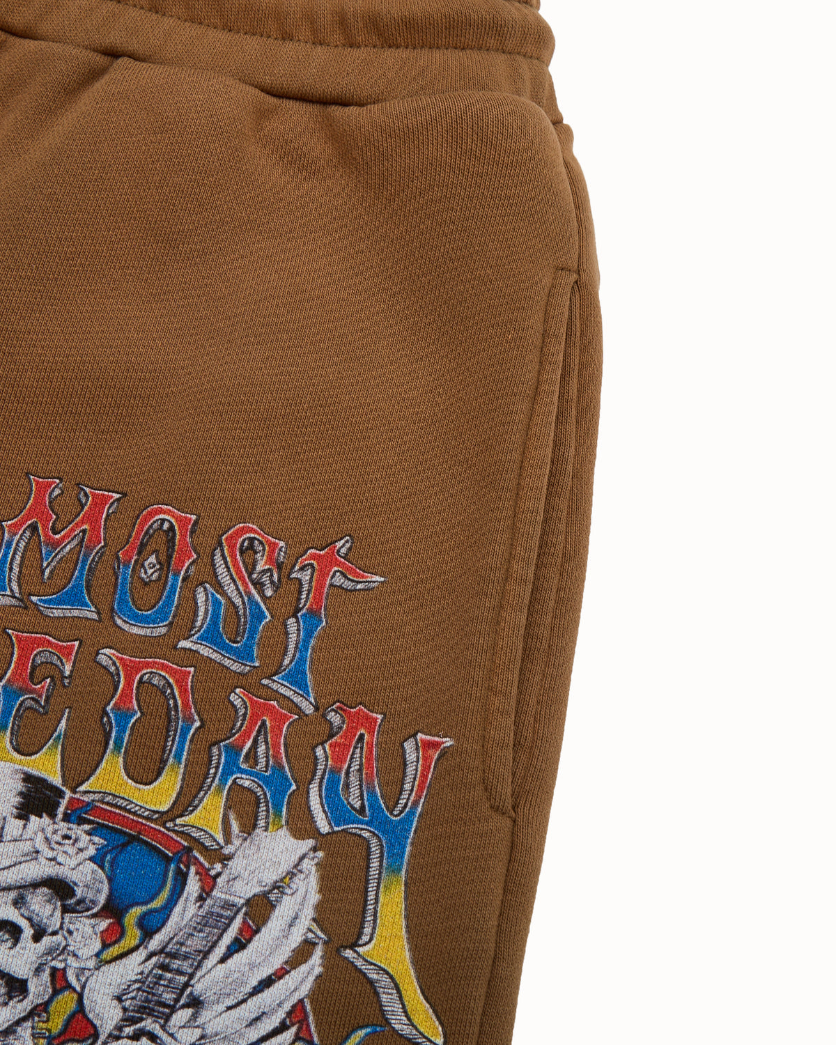 Brown sweatshorts with colorful graphic design on a white background