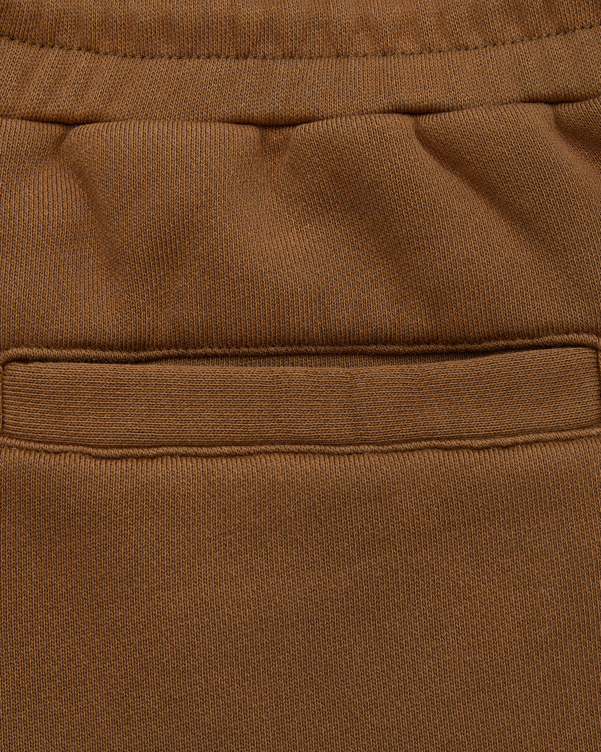 Close-up of brown fabric with a pocket