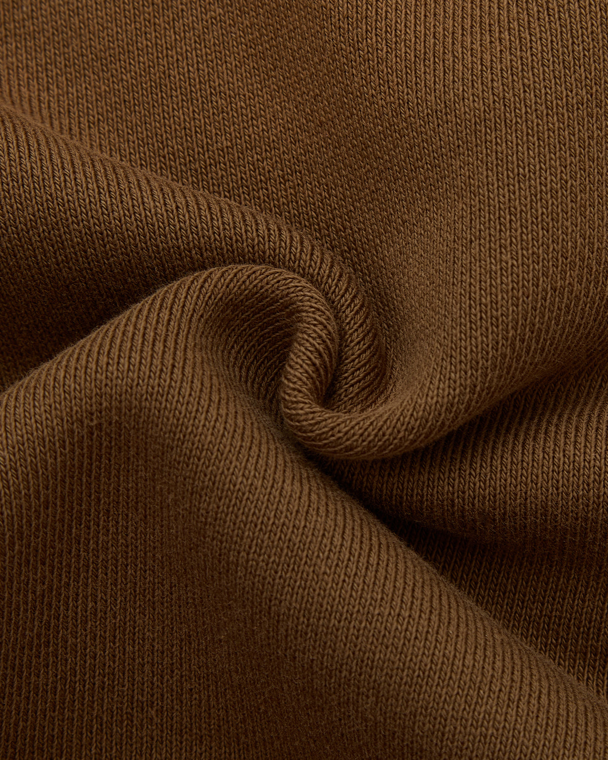 Close-up of brown fabric with a textured pattern