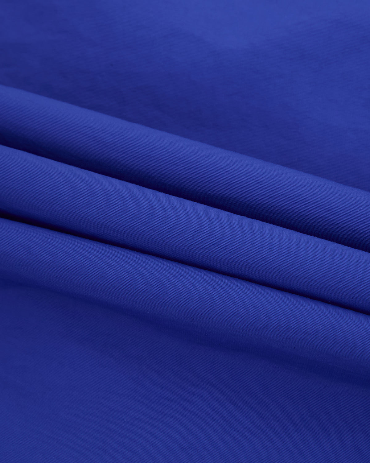 Close-up of blue fabric with a subtle texture