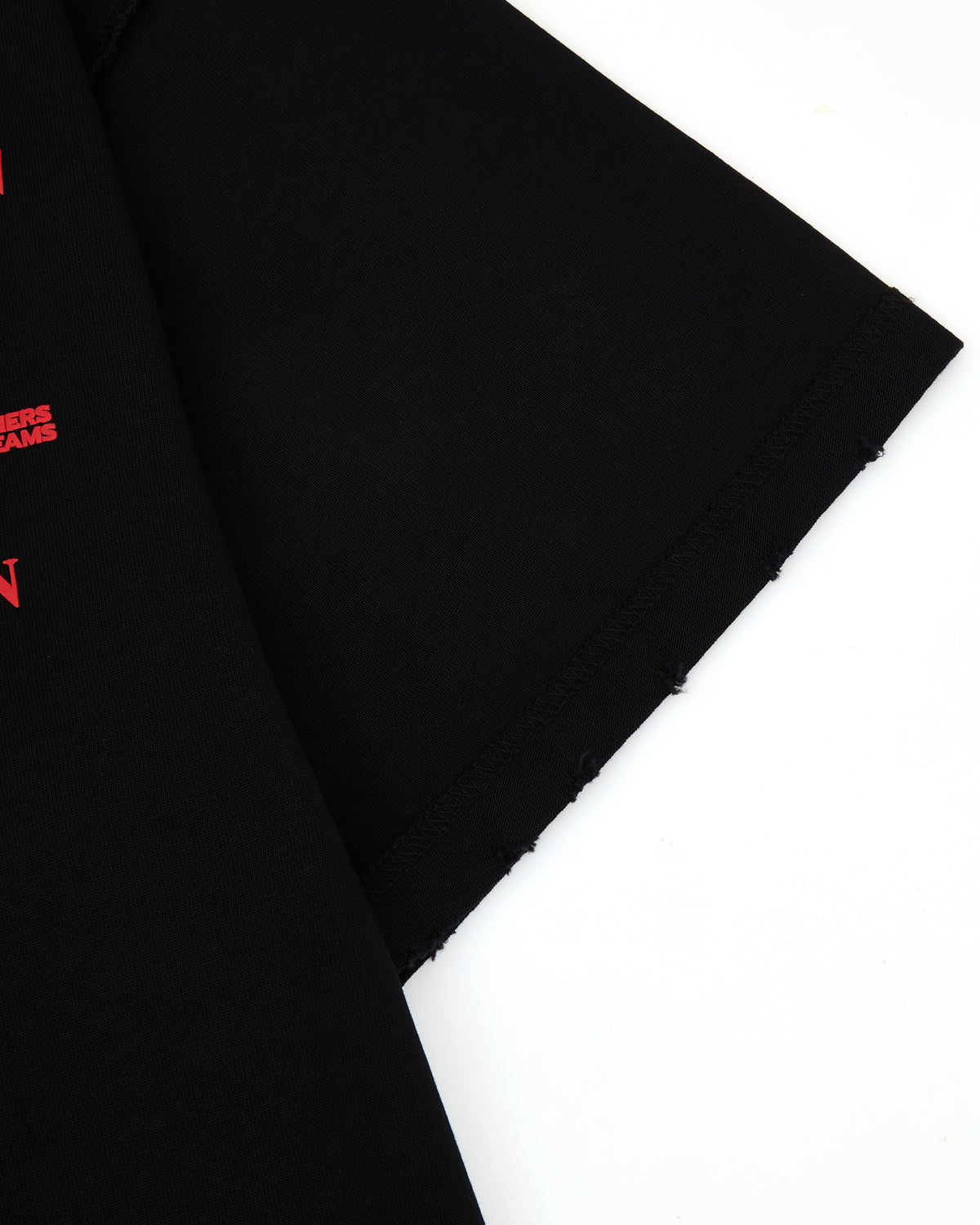 Black fabric with red graphic text on a white background