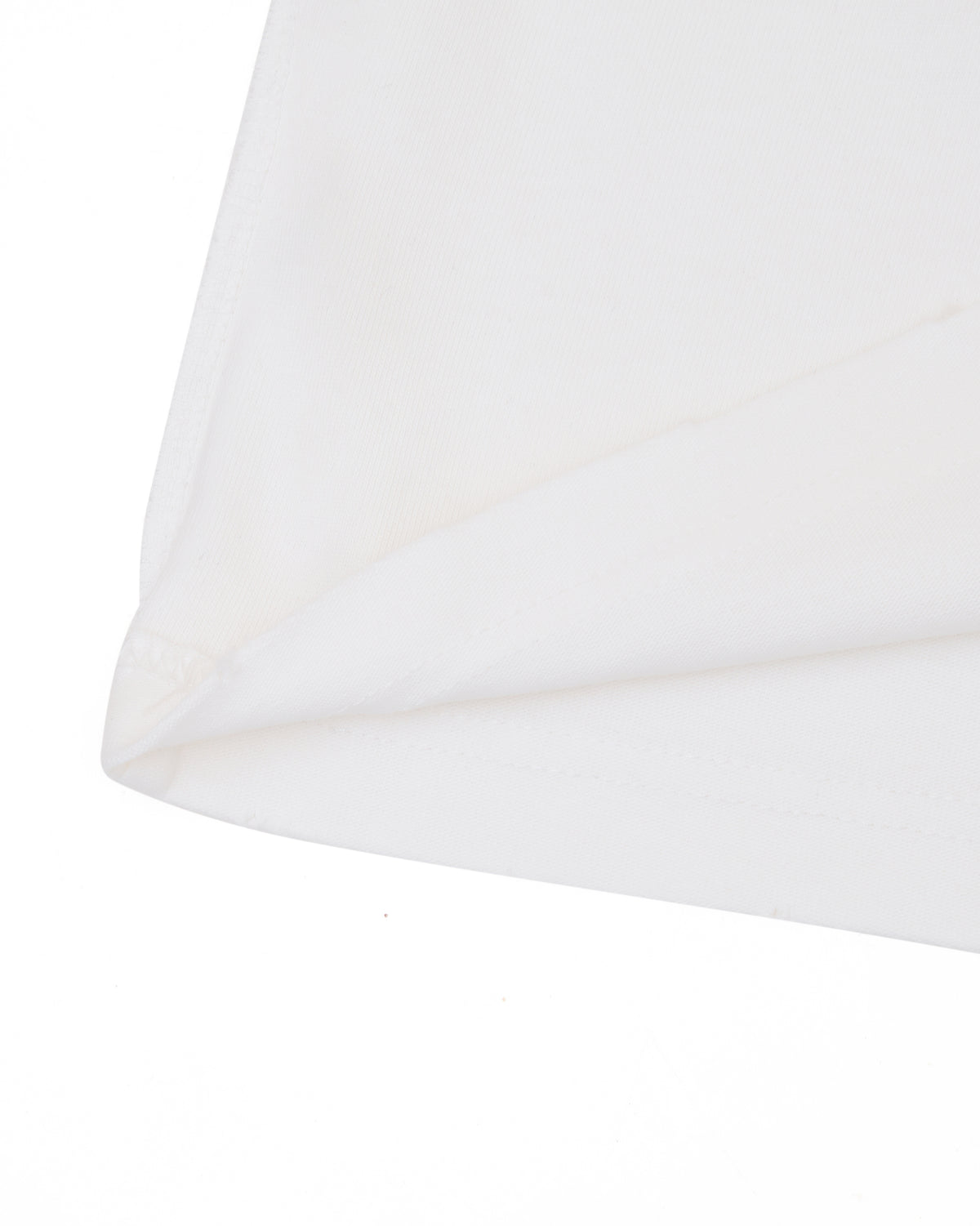 Close-up of a cream tshirt on a white background