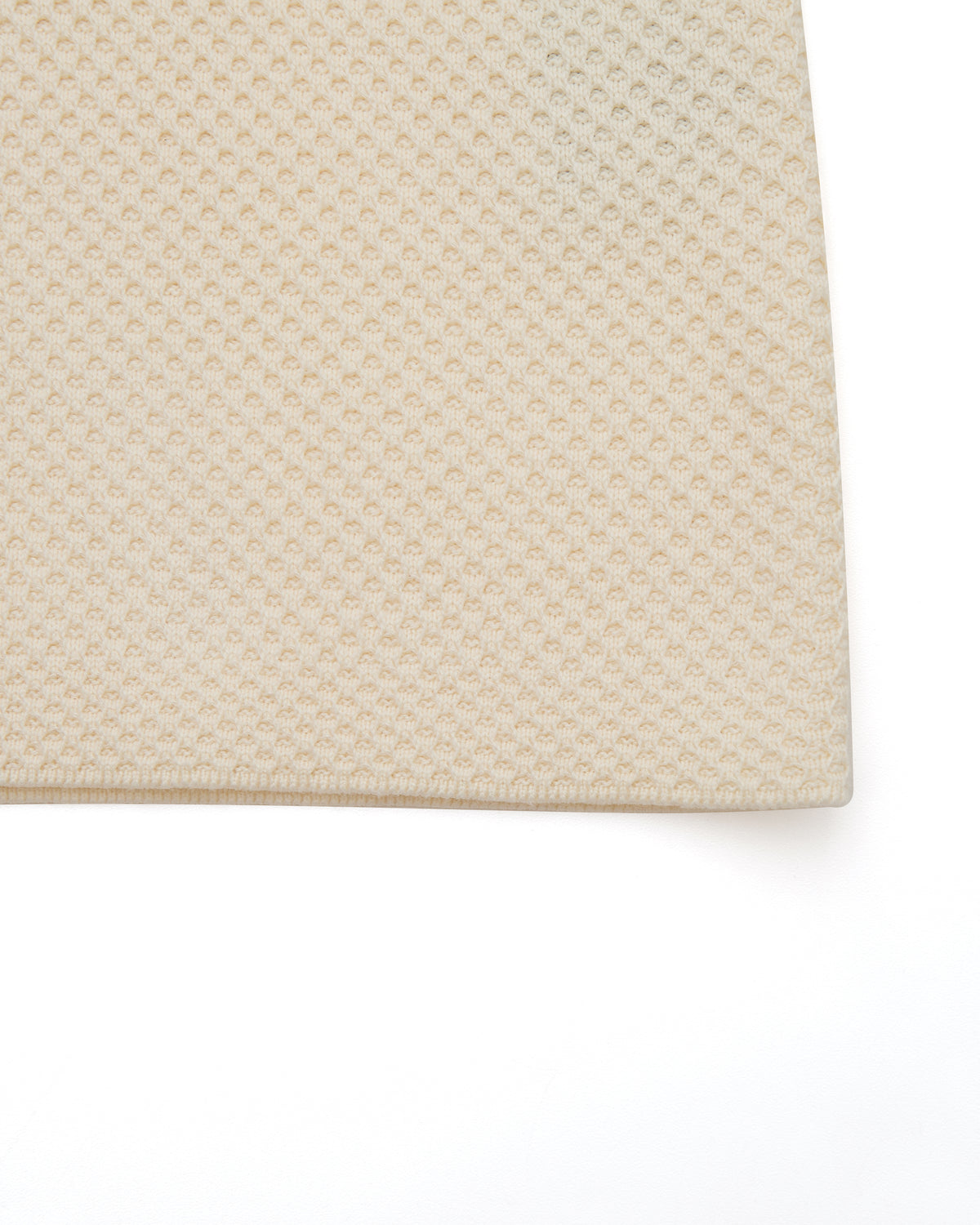 Beige textured rug on a white background