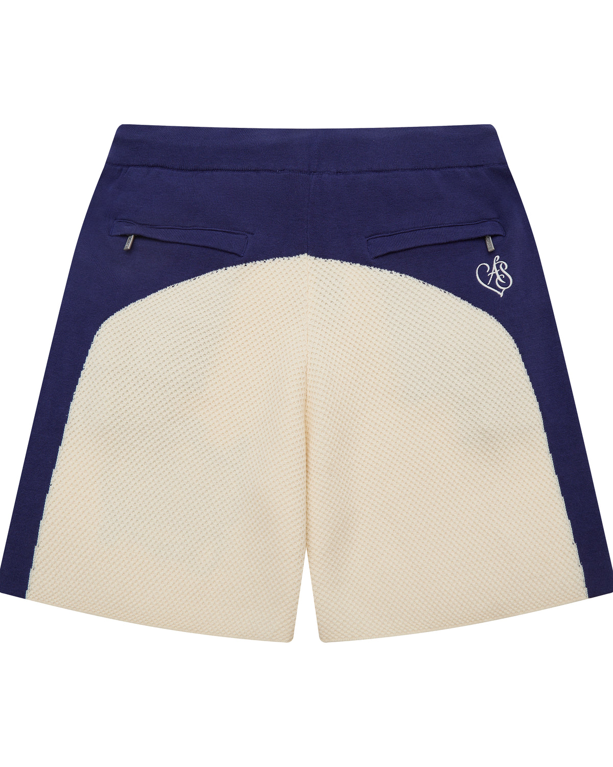 Navy and cream shorts with a logo on a white background