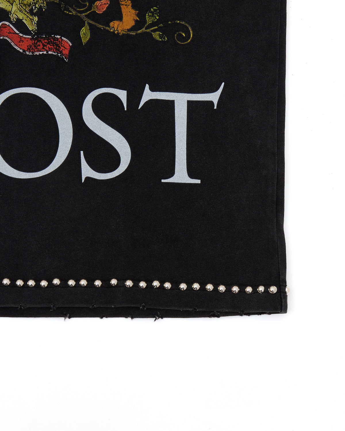 Black fabric with white text 'ALMOST' and decorative elements on a white background