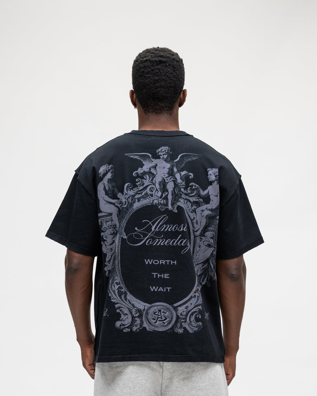 ALMOST SOMEDAY Flourish Tee in Black, back view