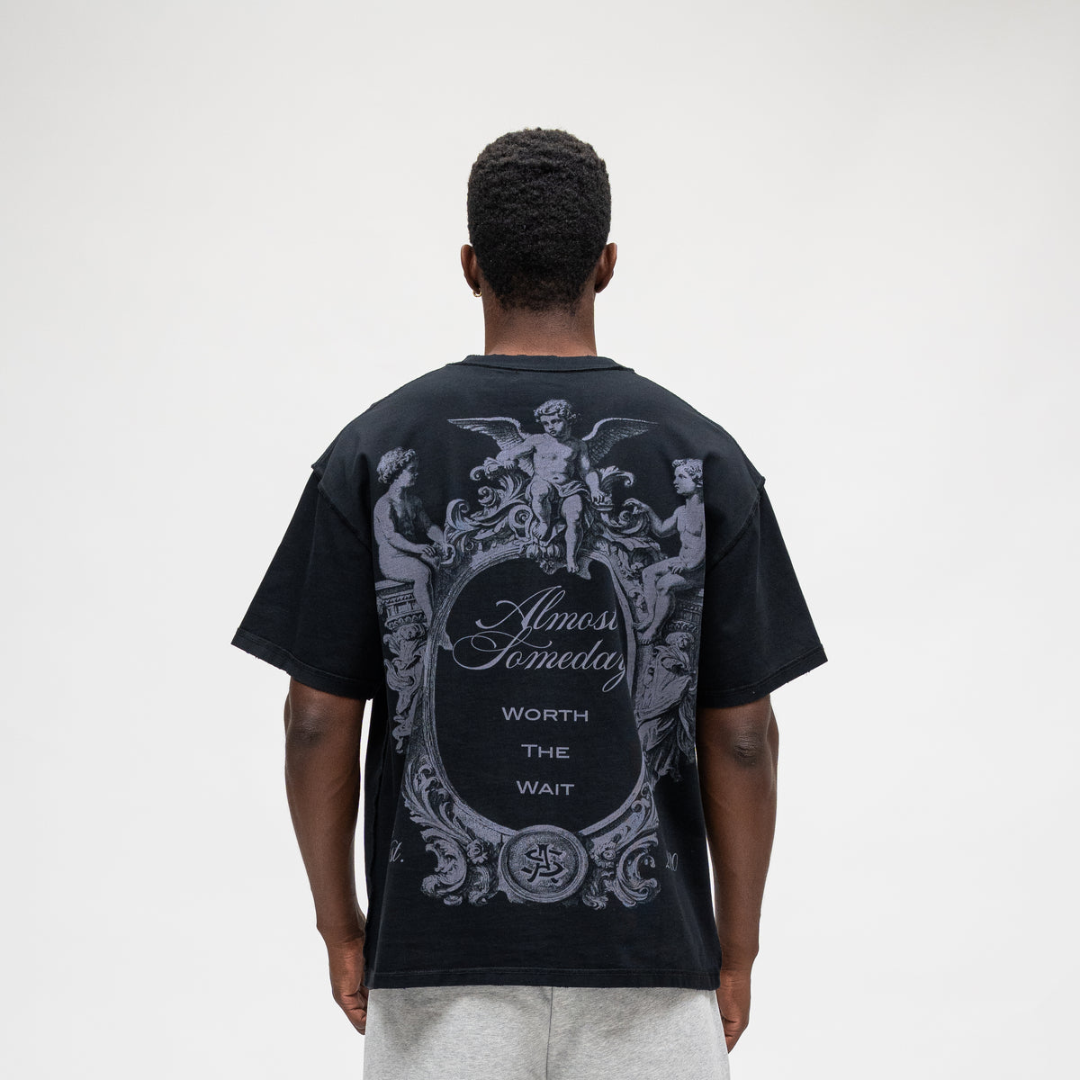ALMOST SOMEDAY Flourish Tee in Black, back view