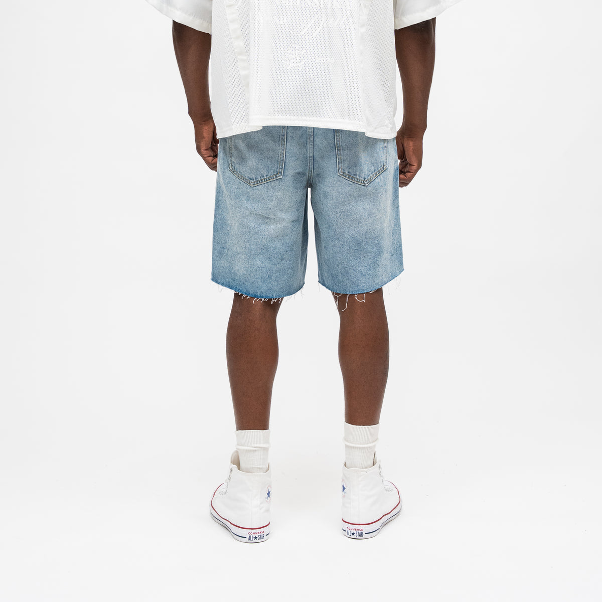 ALMOST SOMEDAY Letterman Denim Jort in Blue Wash, back view showing 5-pocket construction and subtle distressing