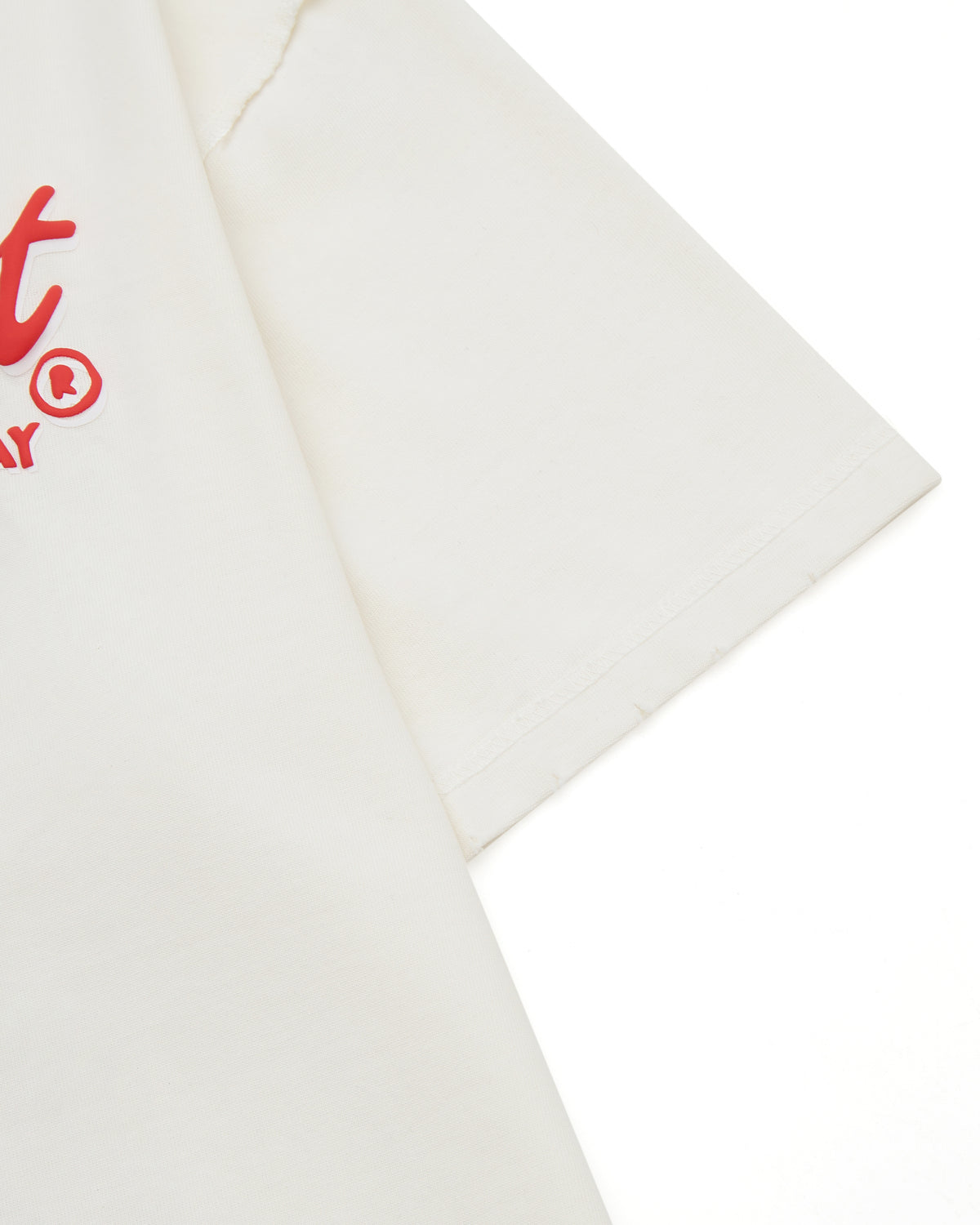 Cream t-shirt with red logo on a white background