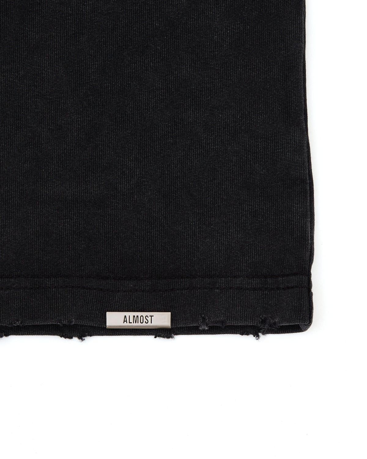 Black fabric with 'ALMOST' label on a white background