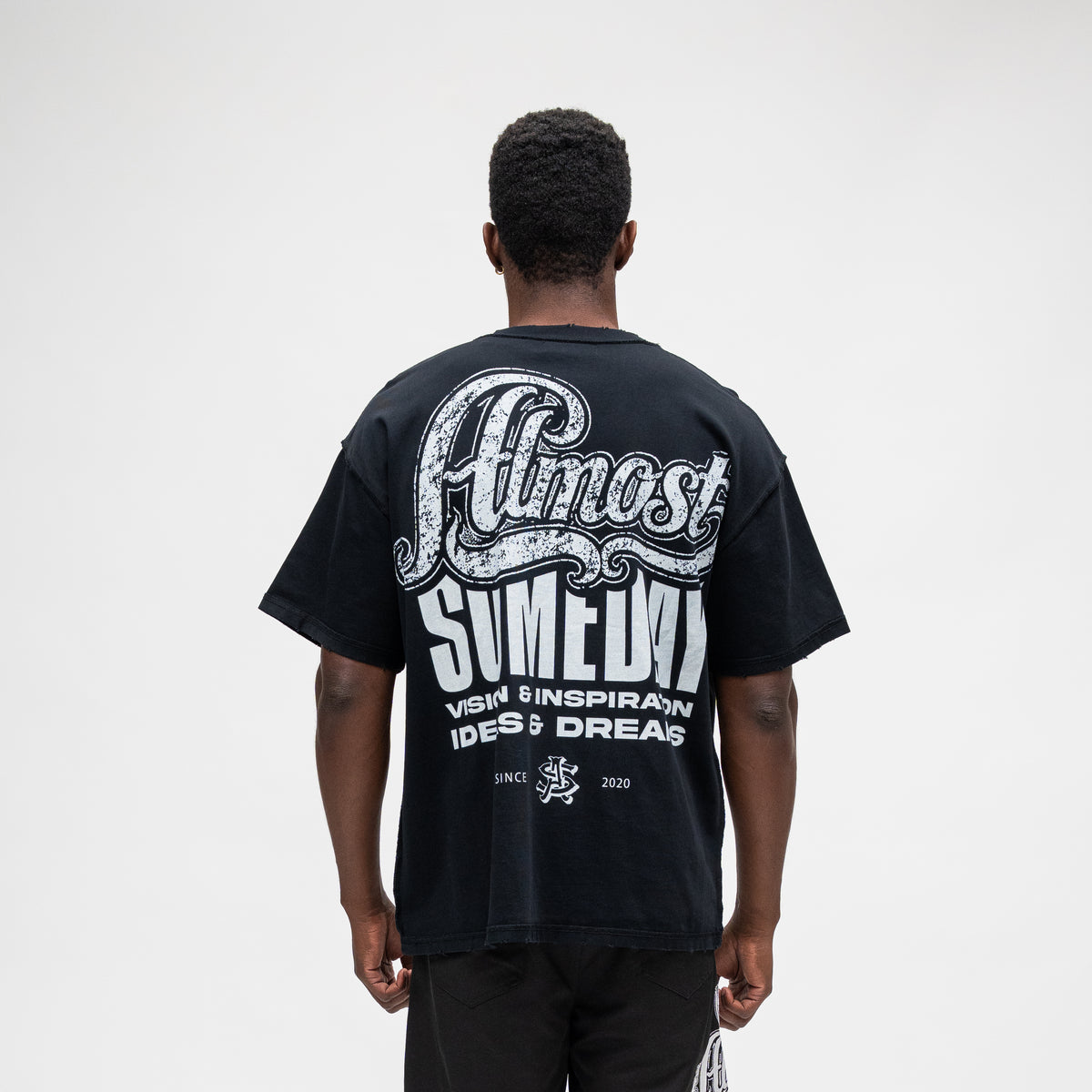 ALMOST SOMEDAY Vision Tee in Black, back view with full-back Almost Someday graphic print