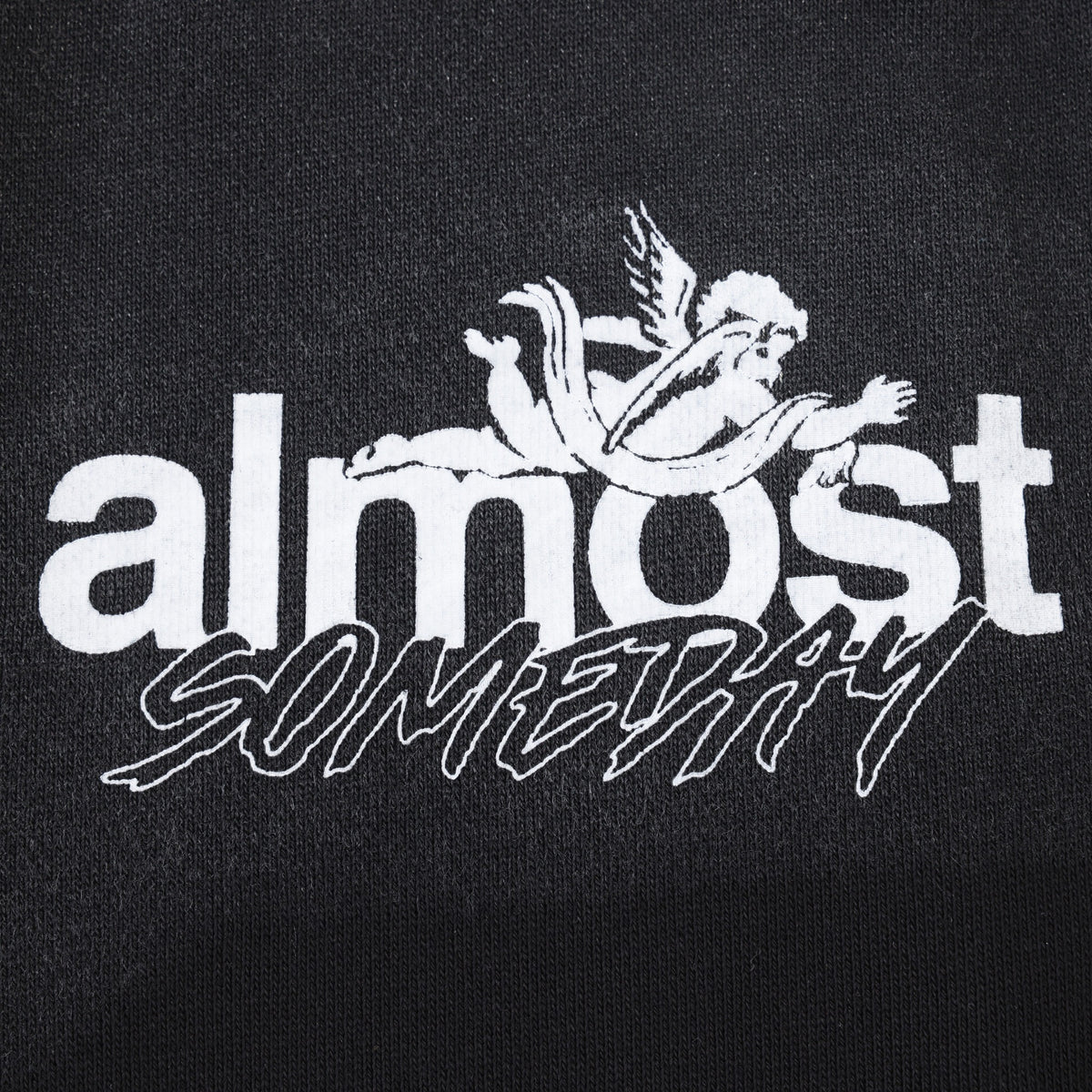 Enemies Flare Bottoms – Black – Close-up of white ALMOST SOMEDAY lettering and winged figure logo
