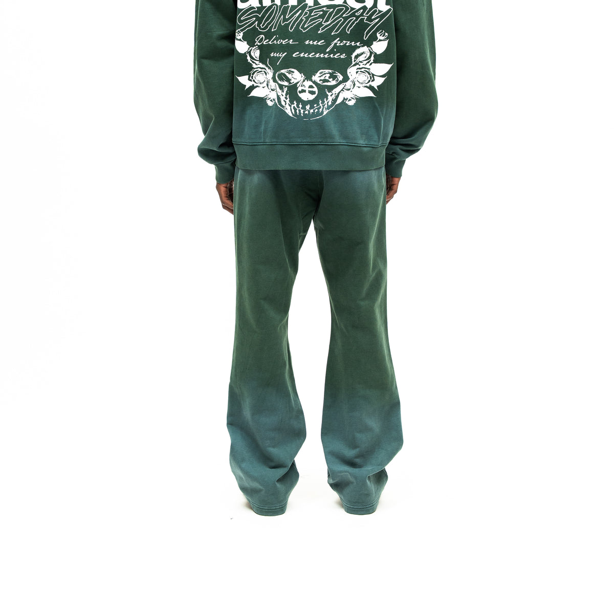 Enemies Flare Bottoms – Green – Back view on model styled with a matching zip hoodie, showing flared legs and faded green finish