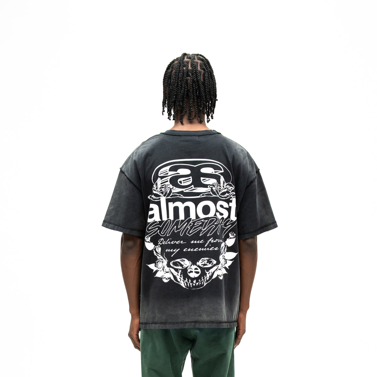 Enemies Tee – Black – Back view on model showing large white lettering, cherubs, roses, and skull graphic