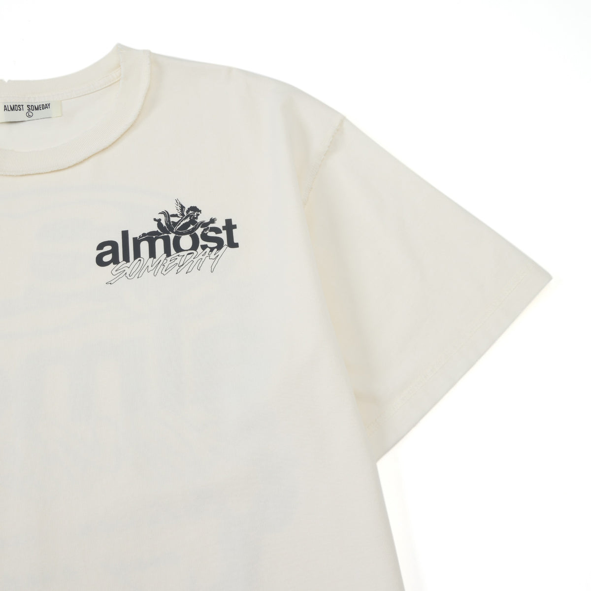 Enemies Tee – Cream – Close-up of chest logo, shoulder seam, and short sleeve