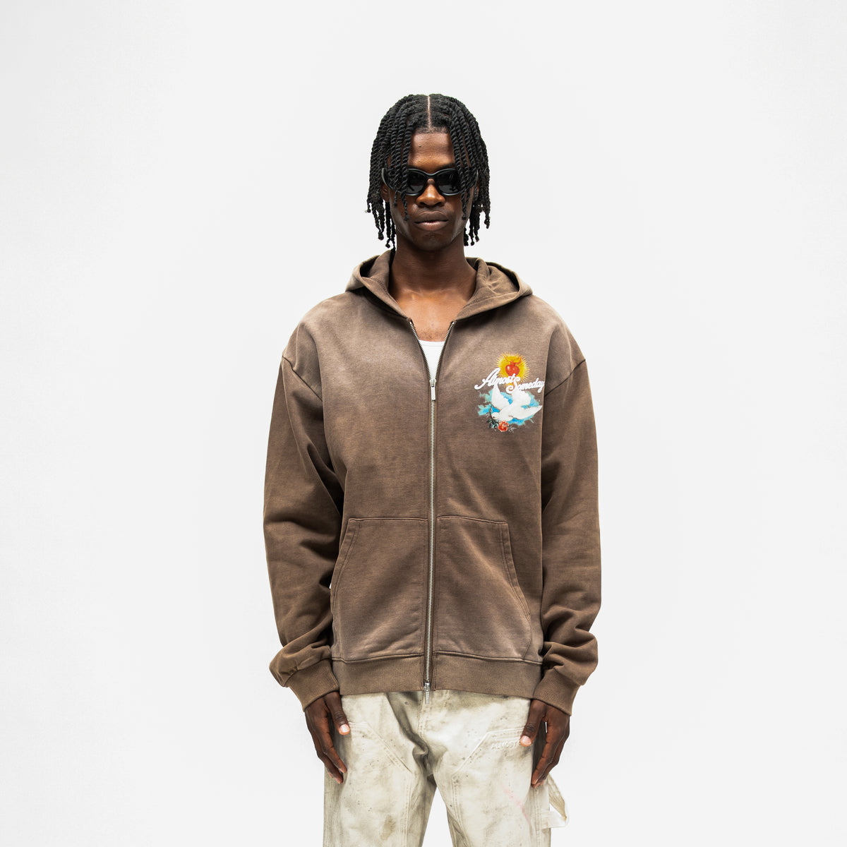 Fountain Hoodie – Brown – Front view on model showing chest graphic, full zipper, and split front pockets