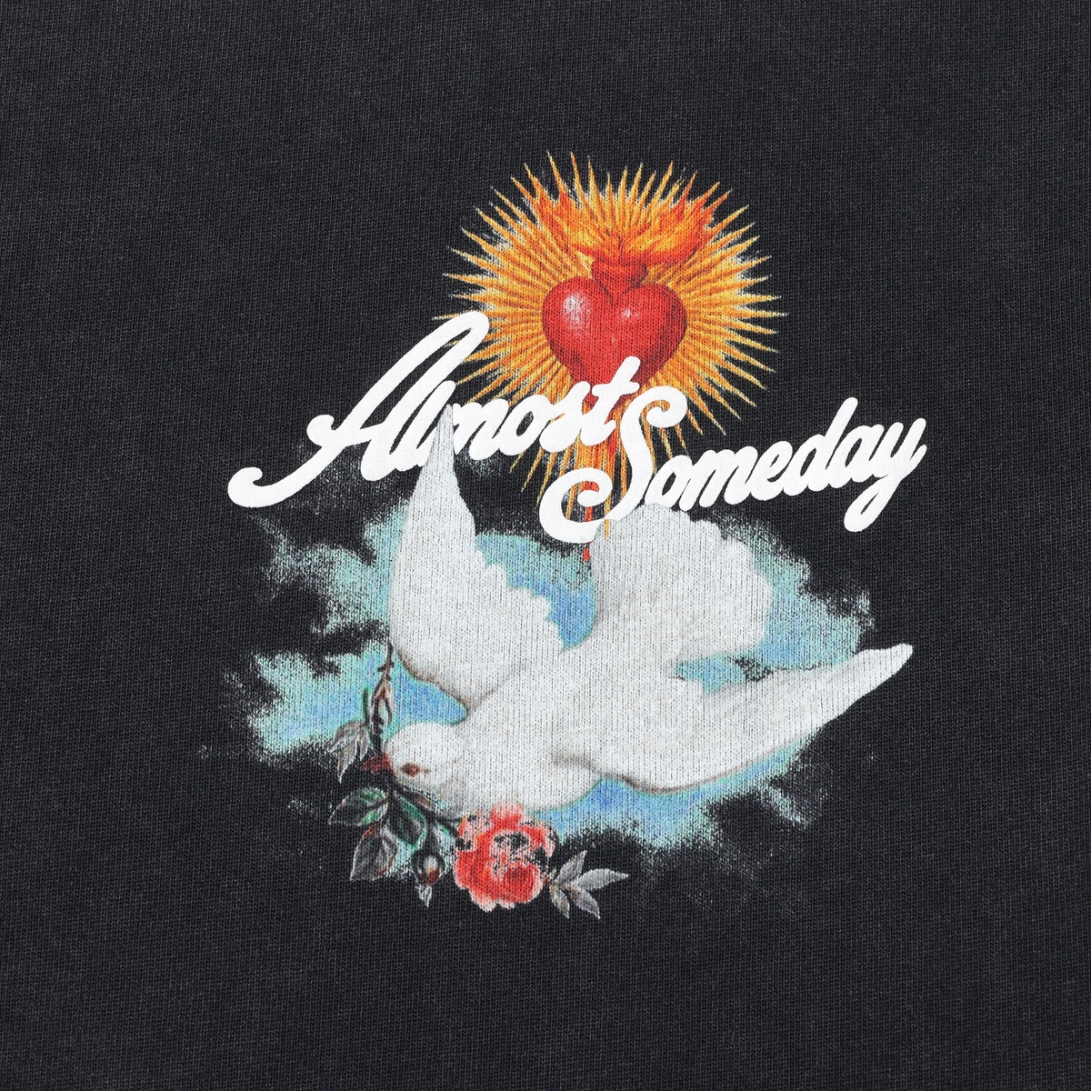 Fountain Tee – Black – Close-up of chest artwork with white dove, red heart, rose, and ALMOST SOMEDAY lettering