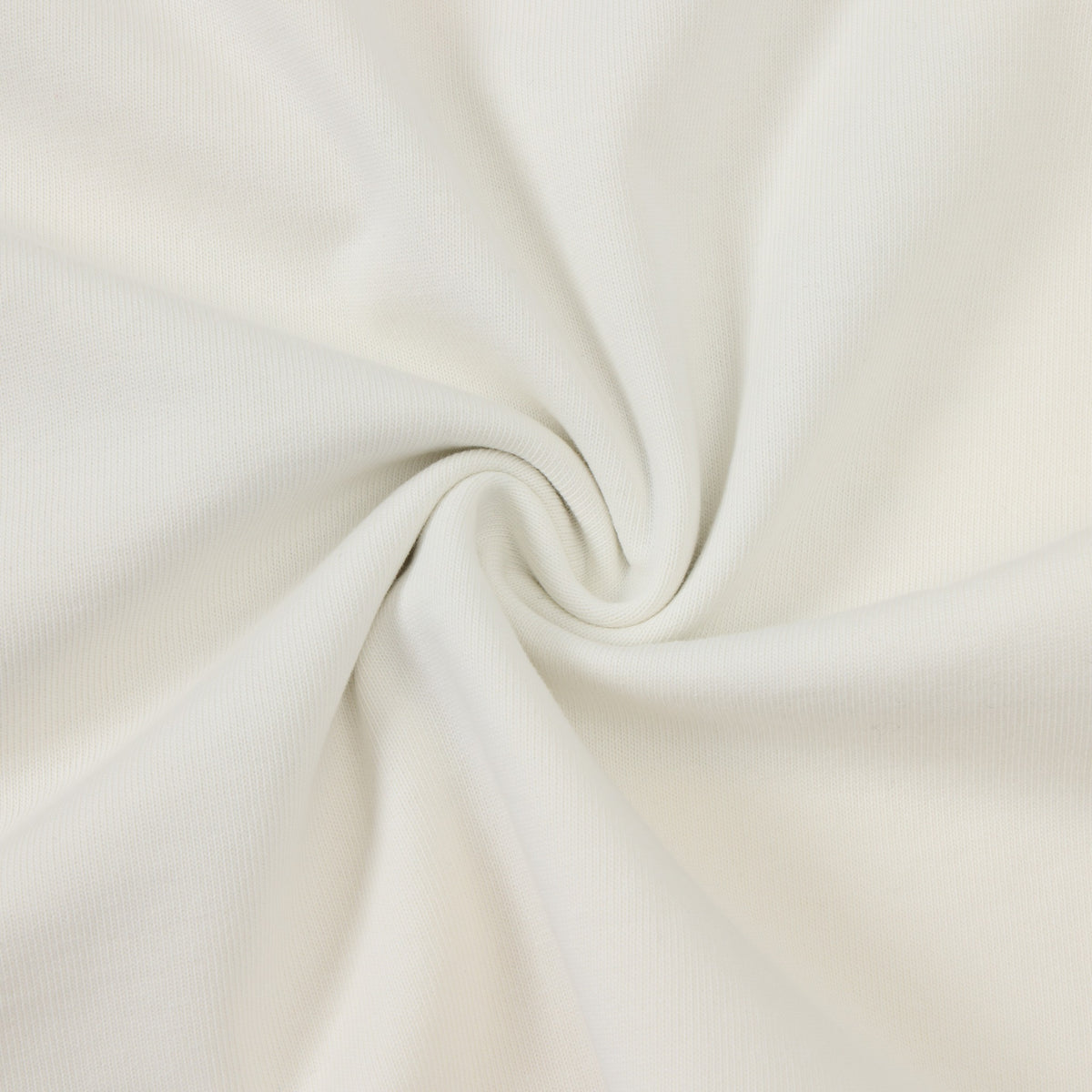 Fountain Tee – Cream – Close-up of fabric texture arranged in soft folds
