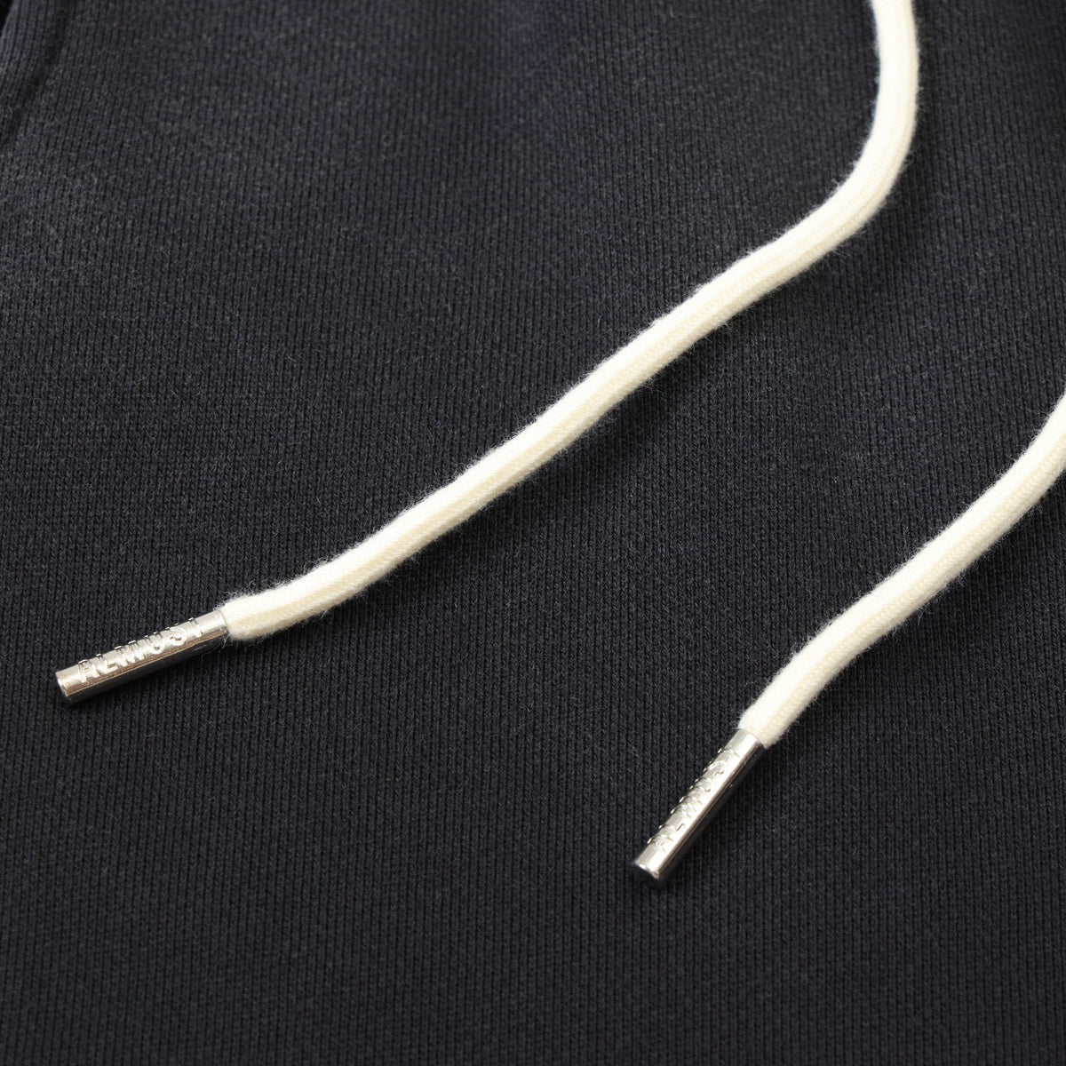 League Flare Sweatpants – Black – Close-up of white drawstrings with silver-tone metal tips
