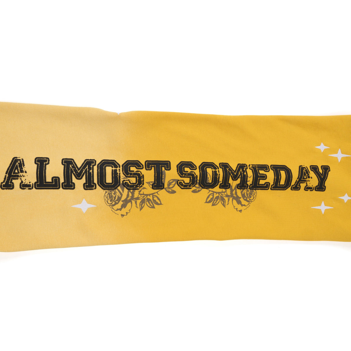 League Flare Sweatpants – Yellow – Close-up of black ALMOST SOMEDAY leg lettering with roses and white stars