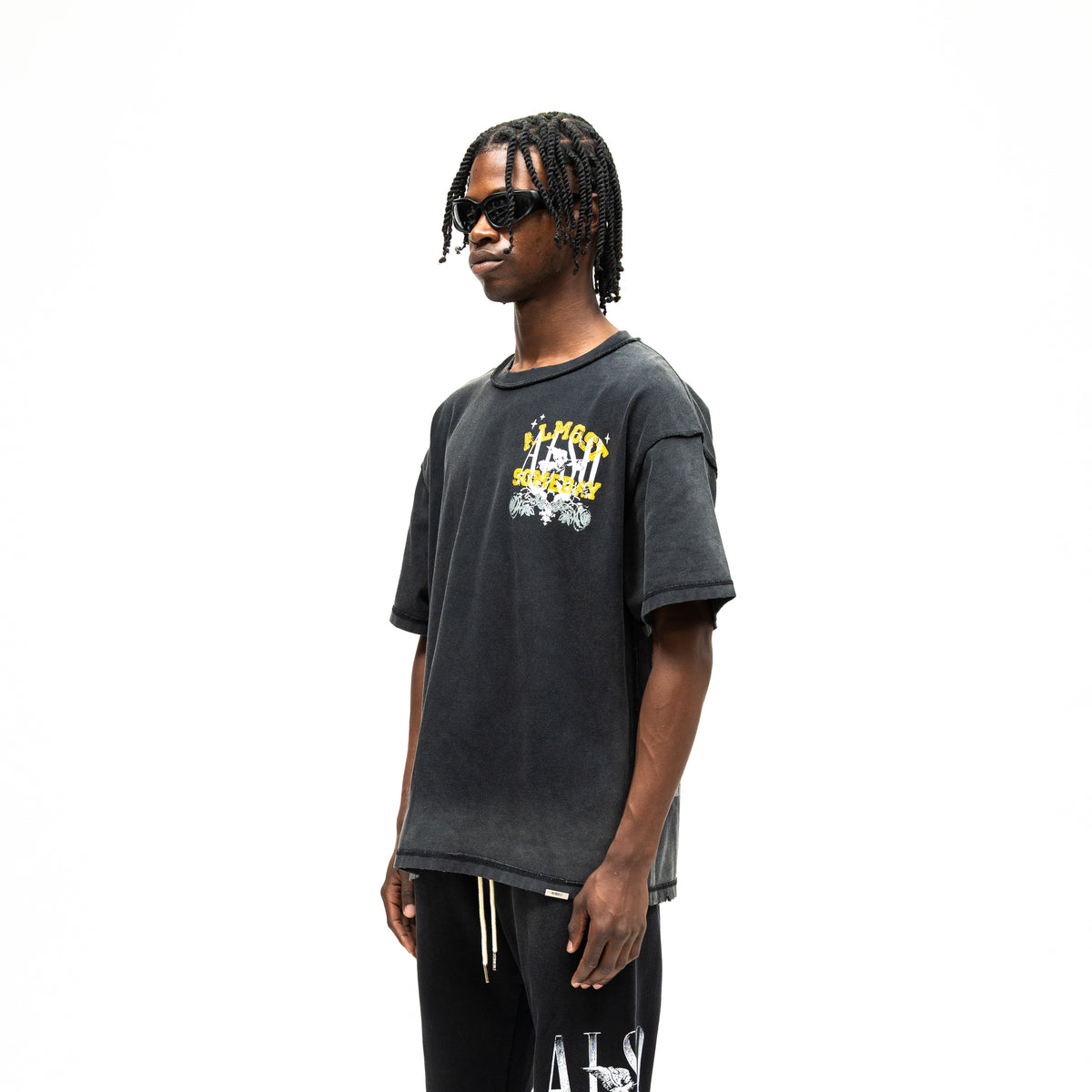League Tee – Black – Three-quarter front view on model showing dropped shoulders