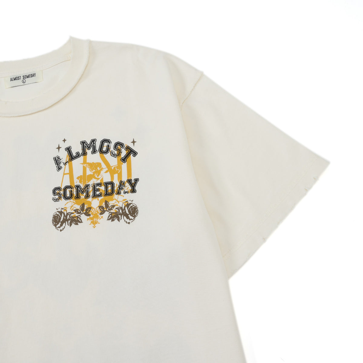 League Tee – Cream – Angled close-up showing chest graphic and sleeve