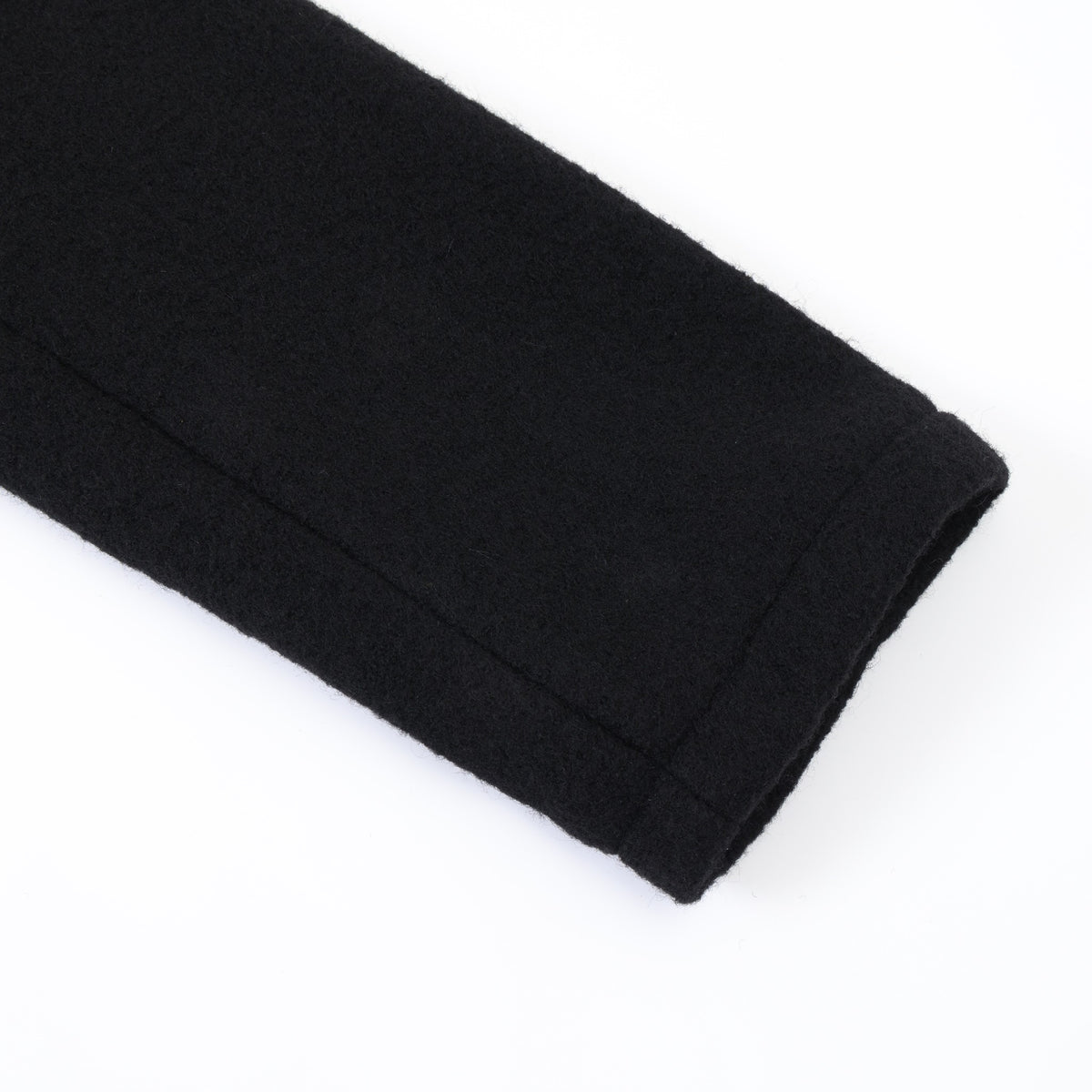 Saint Cropped Wool Jacket – Black – Close-up of sleeve cuff and stitched seam