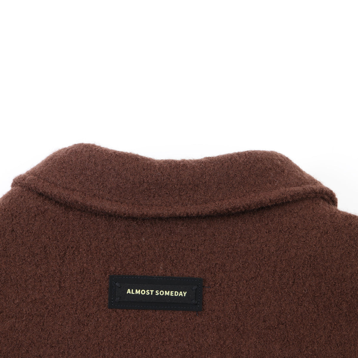 Saint Cropped Wool Jacket – Brown – Close-up of back collar and black Almost Someday brand patch
