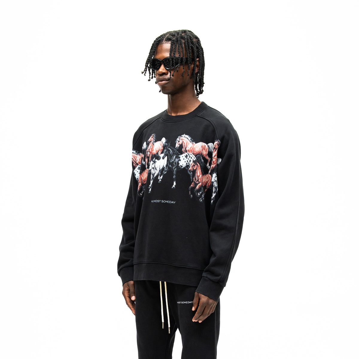 Smoke Crewneck – Black – Three-quarter front view on model showing horse artwork across chest and raglan sleeves
