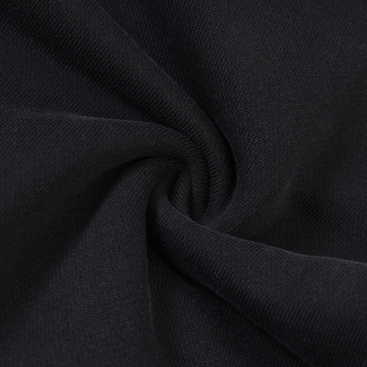 Smoke Flare Bottoms – Black – Close-up of gathered black fabric showing knit texture