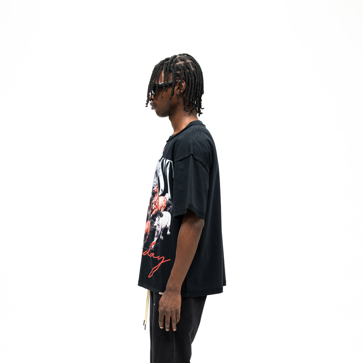 Smoke Tee – Black – Side view on model showing dropped shoulder, short sleeve, and straight hem