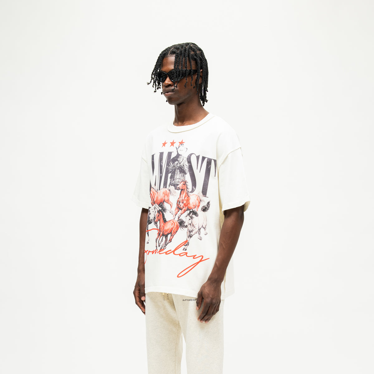 Smoke Tee – Cream – Three-quarter front view on model showing large horse graphic and wide short sleeves