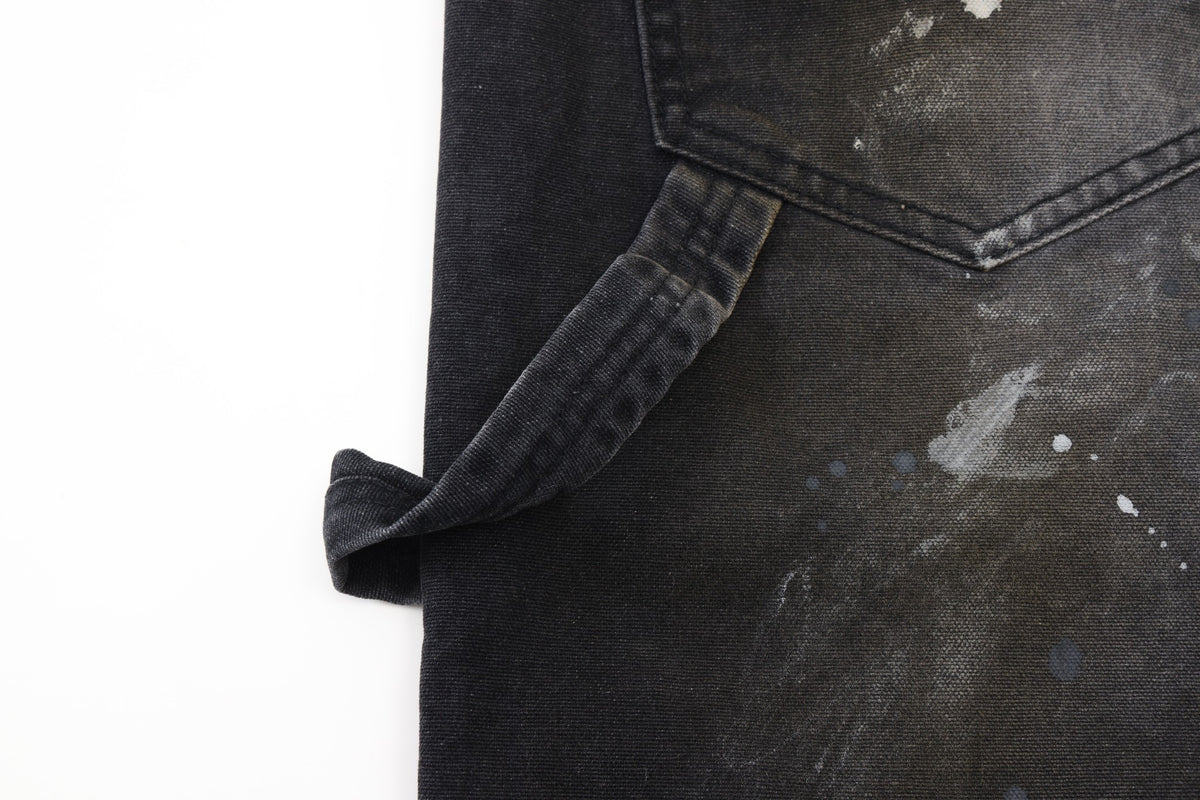 Spade Pants – Black – Close-up of side utility loop beneath rear pocket and paint-splattered fabric