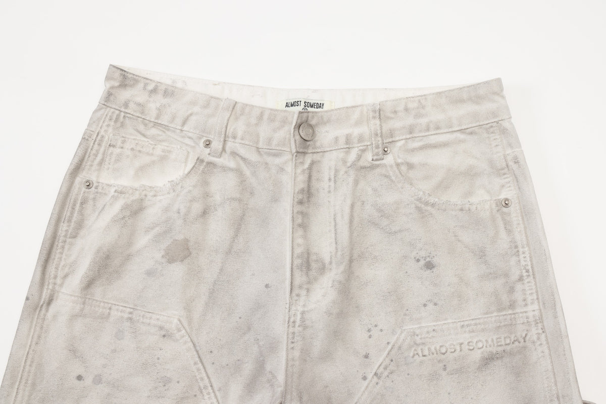 Spade Pants – Cream – Close-up of waistband, silver-tone button and rivets, front pockets, and tonal thigh lettering