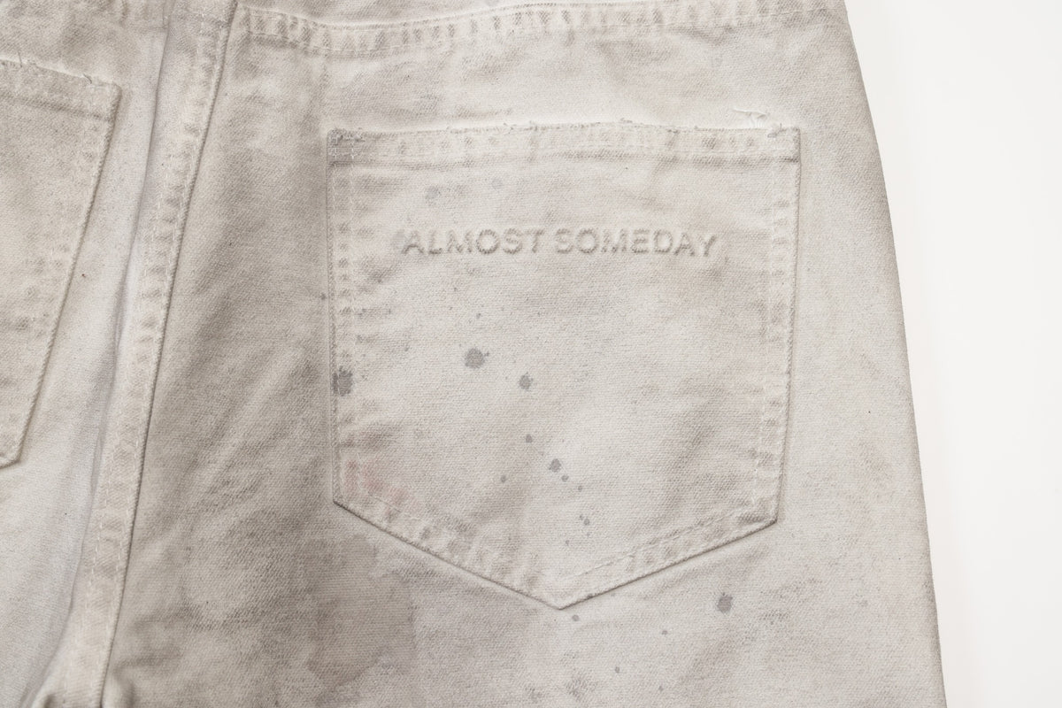 Spade Pants – Cream – Close-up of rear patch pocket with tonal Almost Someday lettering