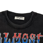 Black shirt with 'ALMOST SOMEDAY' text and brand label on a white background
