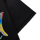 Black fabric with a colorful logo on a white background