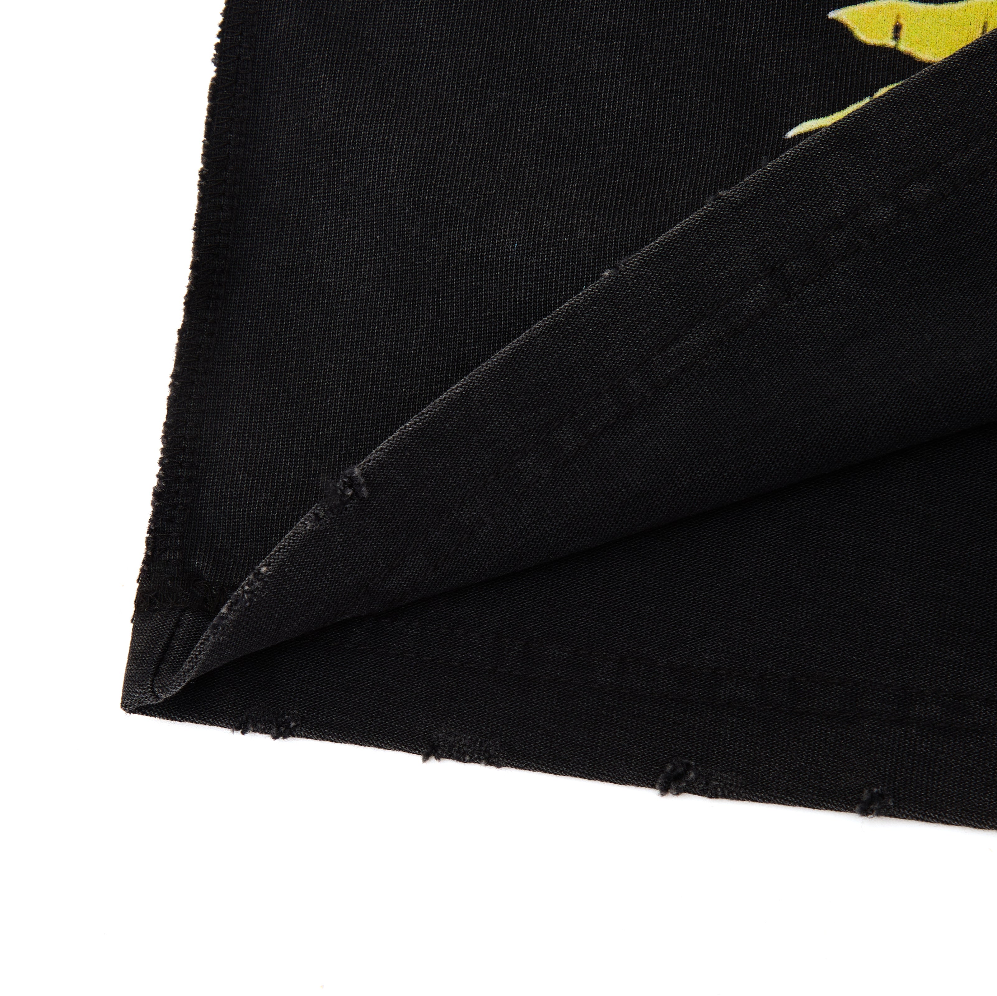 Black fabric with a yellow design on a white background