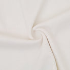 Close-up of beige fabric with a soft texture