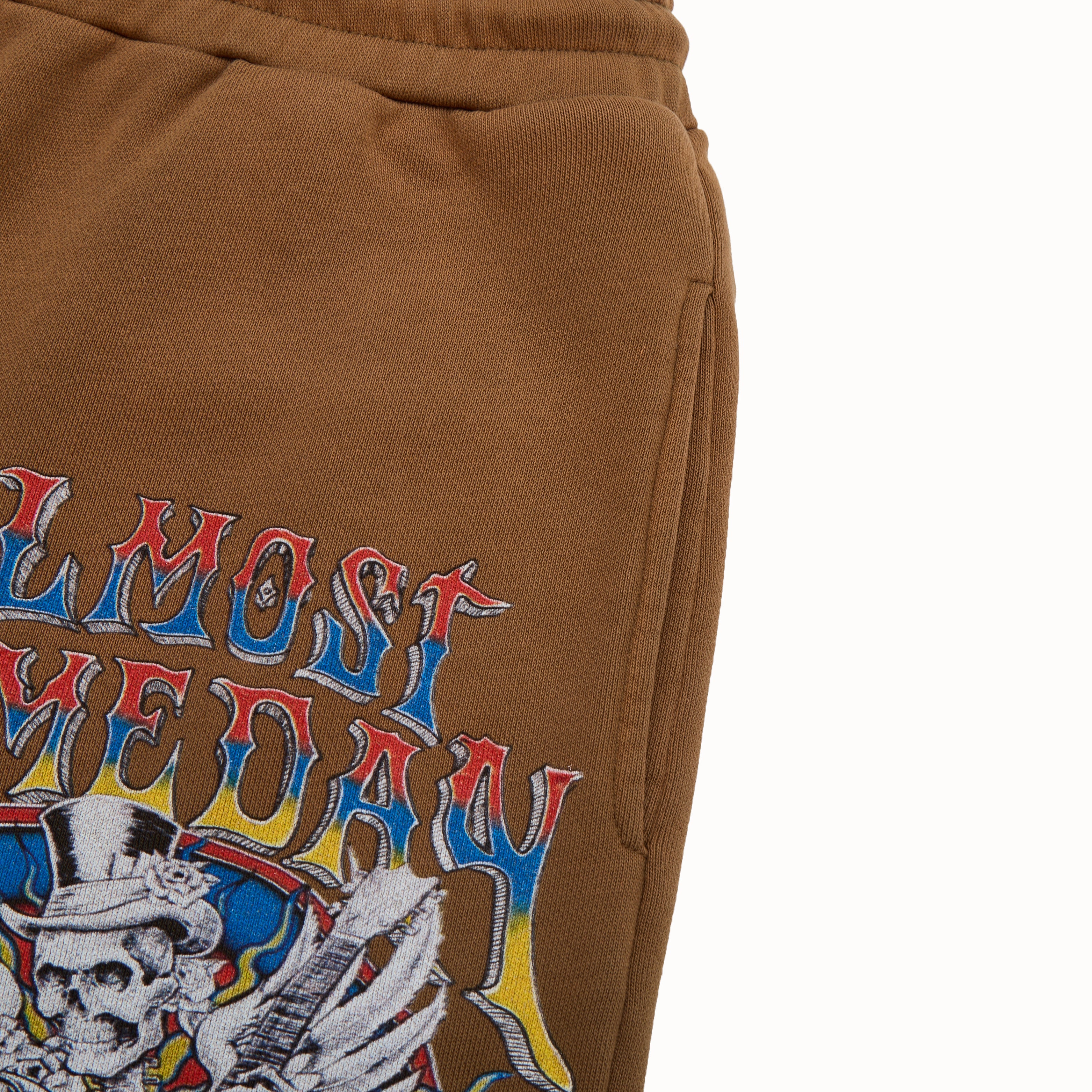 Brown sweatshorts with colorful graphic design on a white background