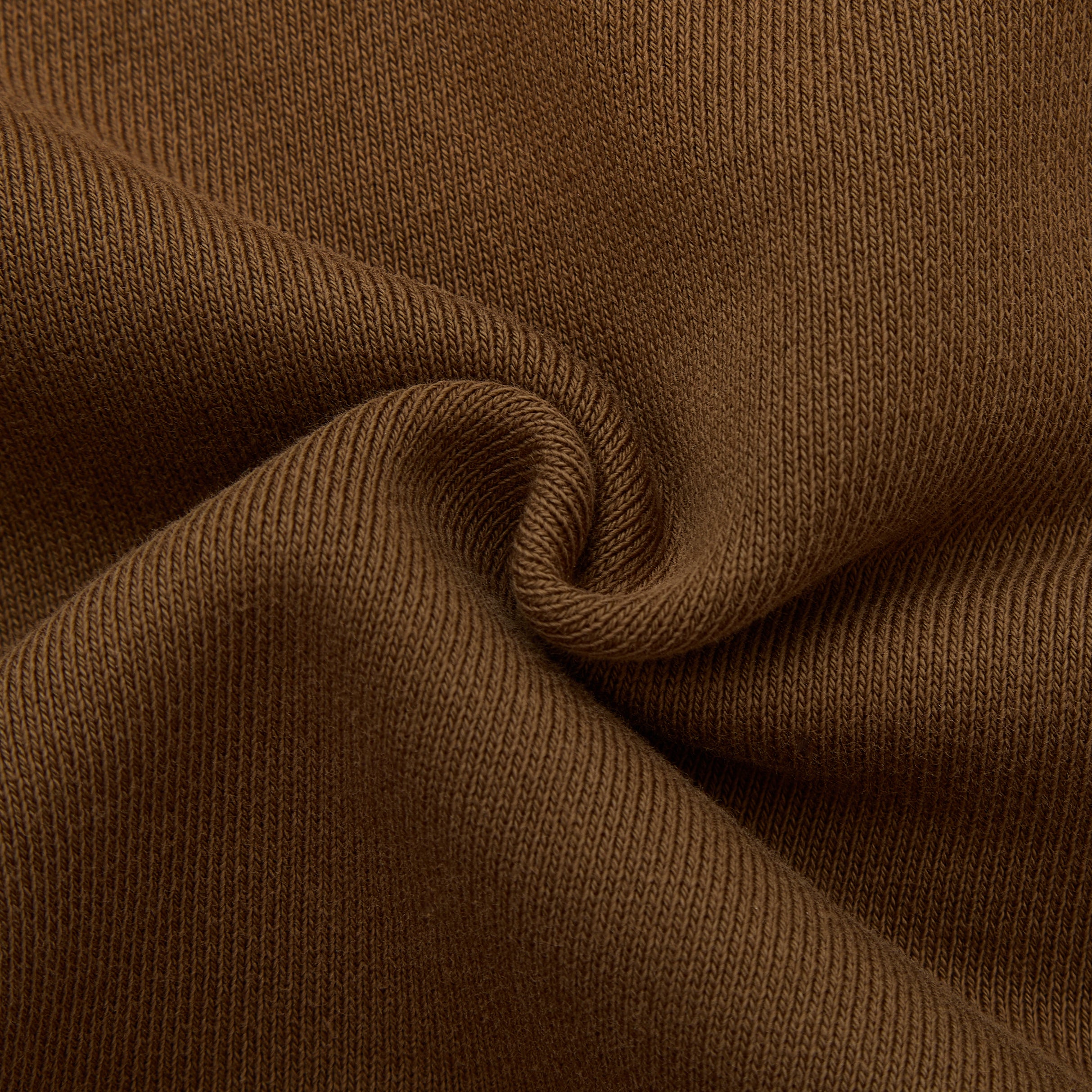 Close-up of brown fabric with a textured pattern