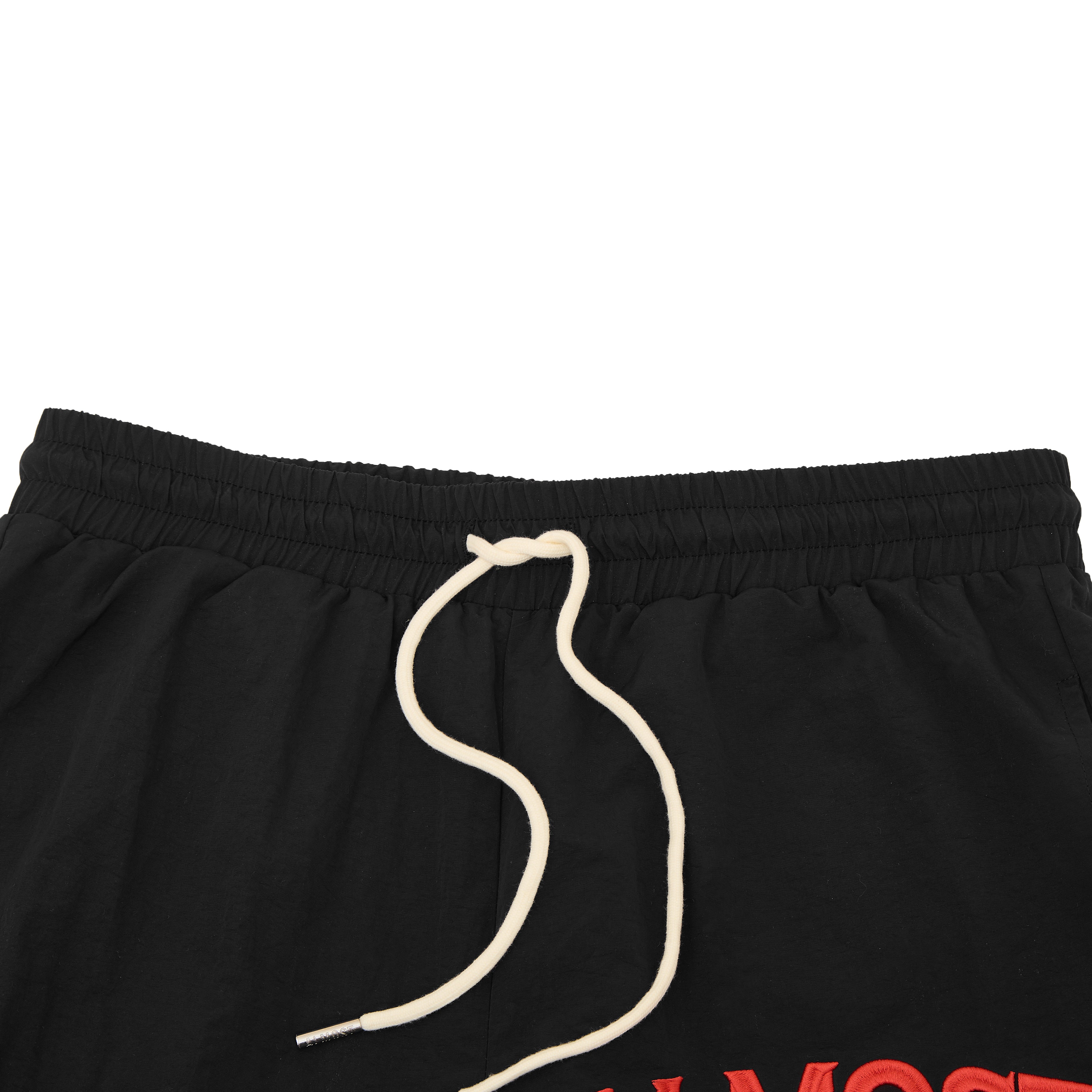 Black shorts with a red logo and white drawstring on a white background