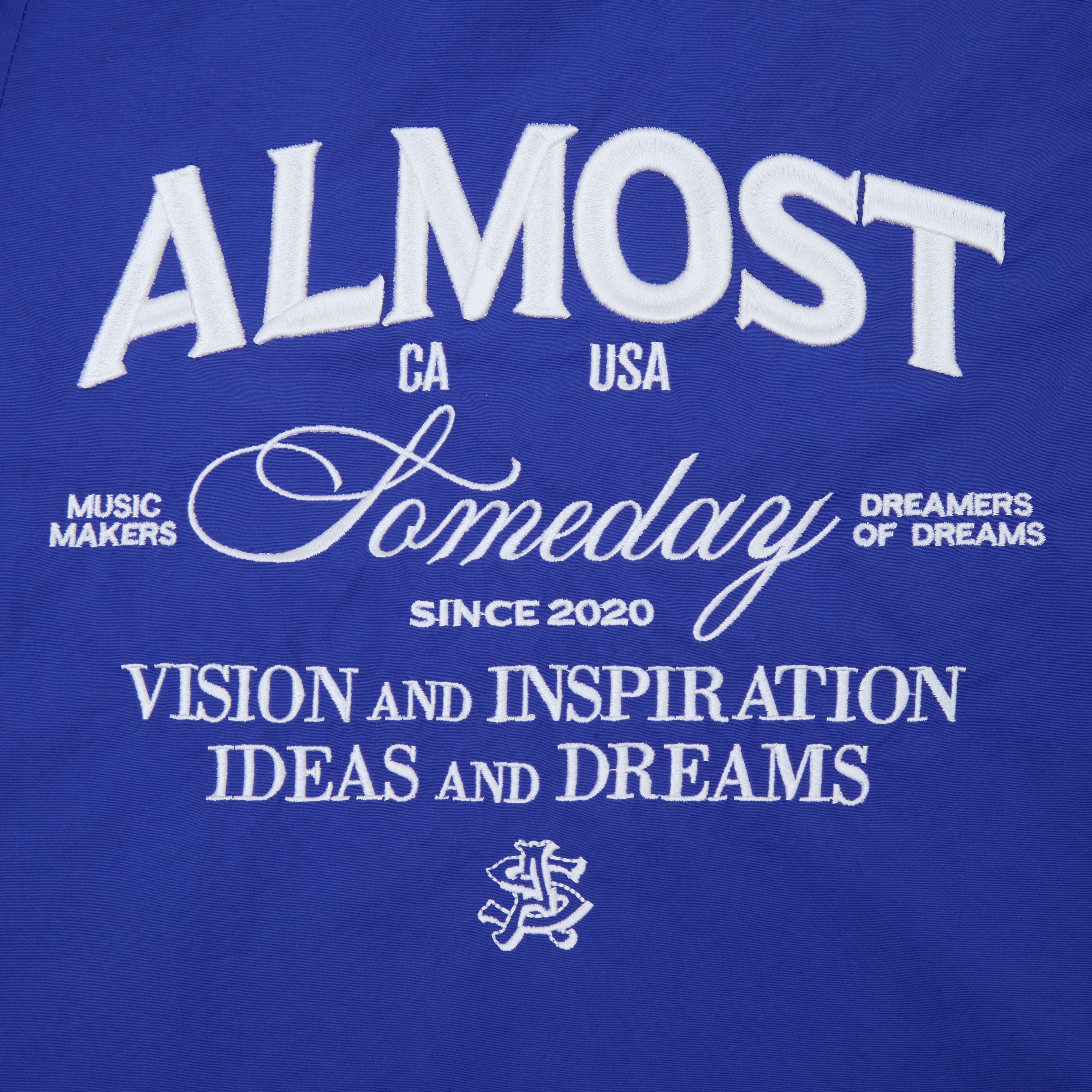 Blue shorts with white text and graphics on a blue background