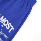 Blue shorts with white text on a white background