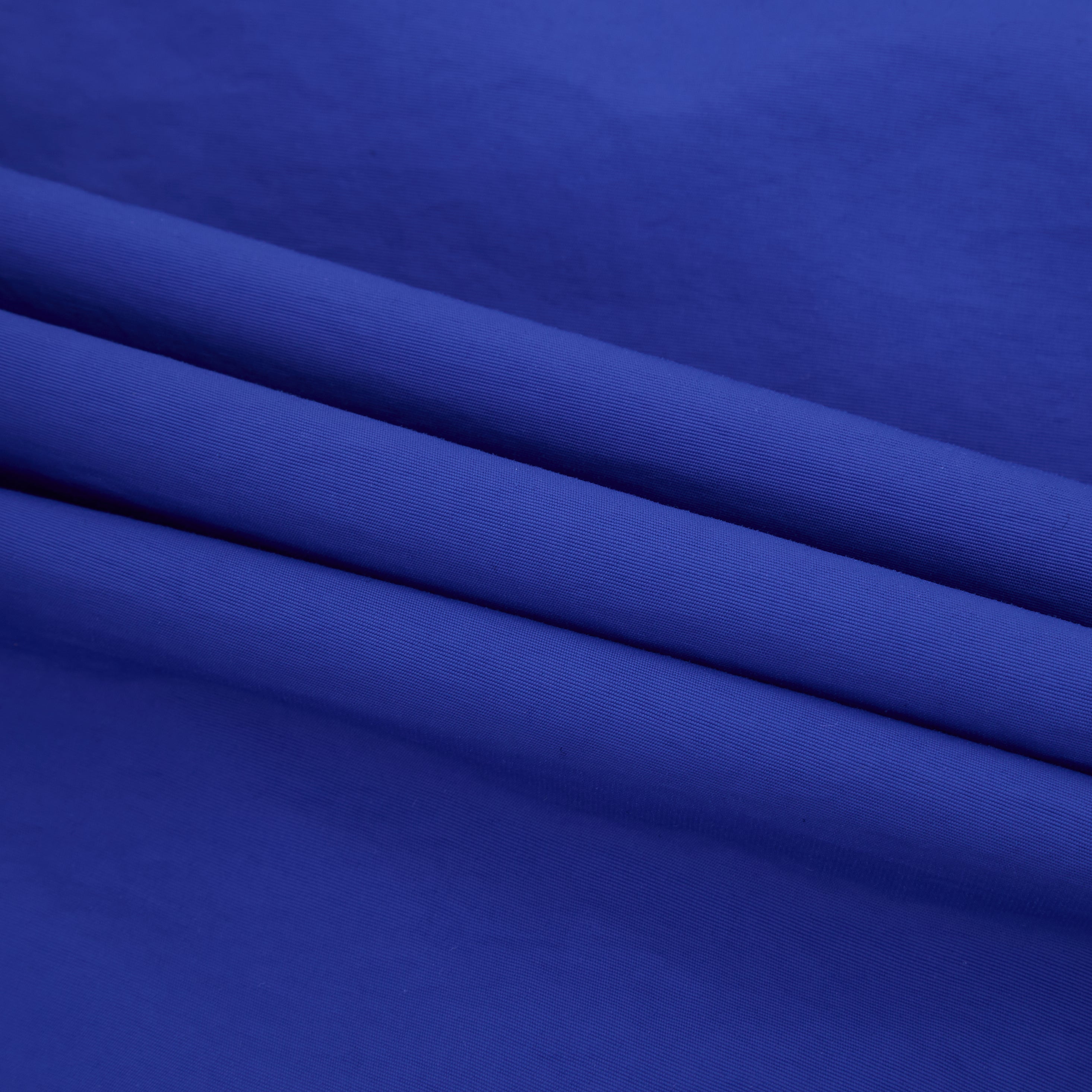 Close-up of blue fabric with a subtle texture