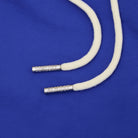 White cord with silver ends on a blue background