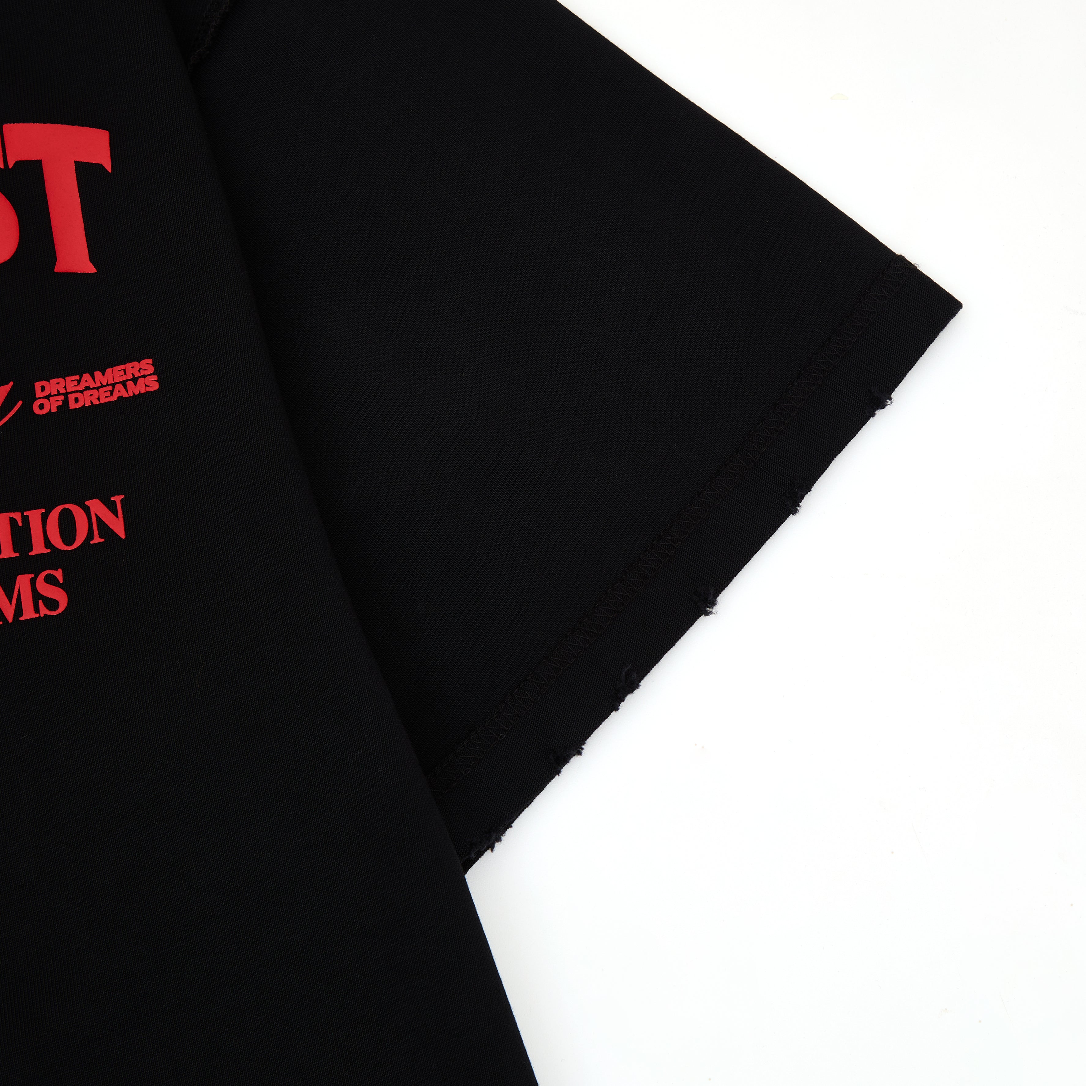 Black fabric with red graphic text on a white background