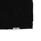 Black fabric with 'ALMOST' label on a white background