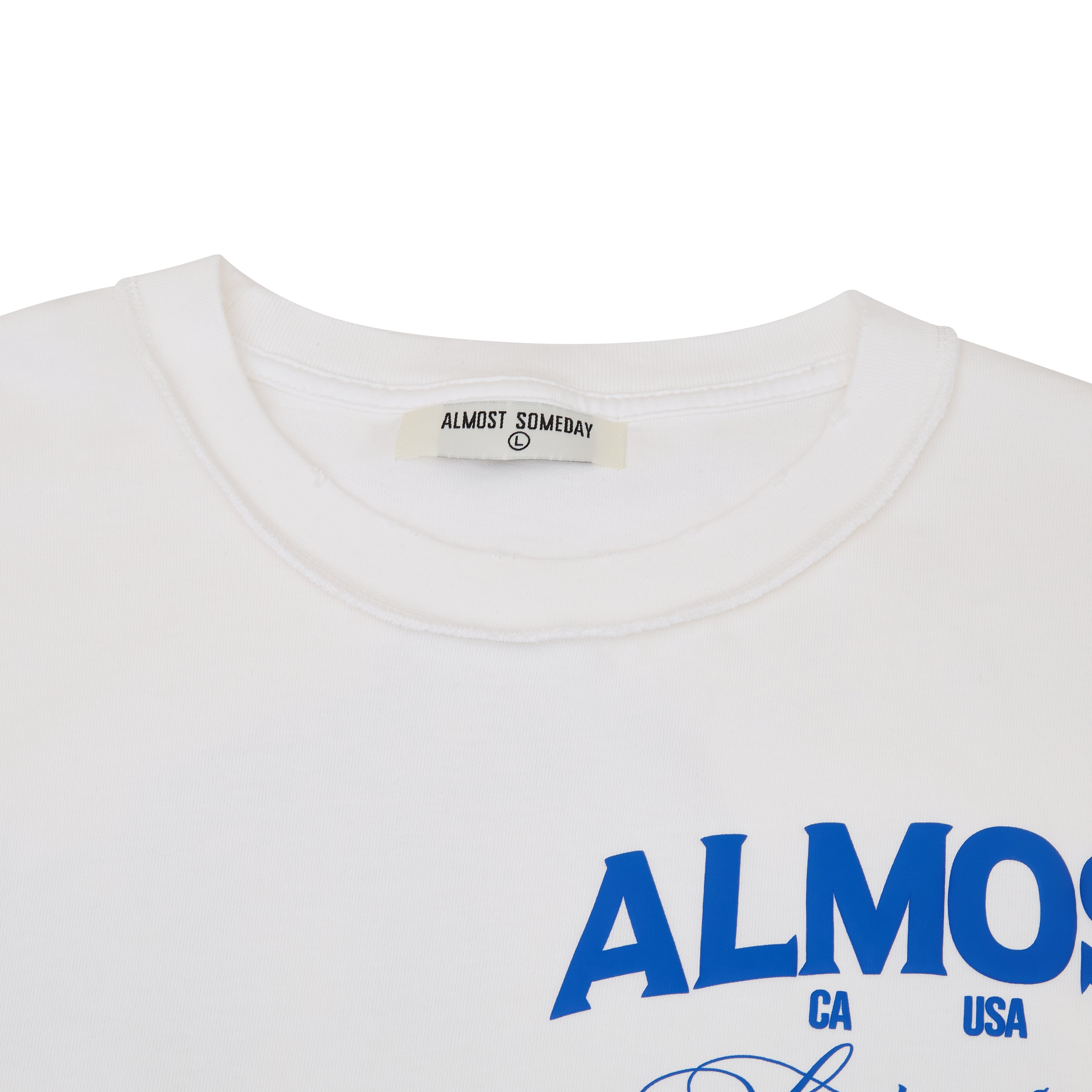 White shirt with blue text 'ALMOST' and a visible brand label on a white background