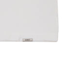 White pillow with 'ALMOST' label on a white background